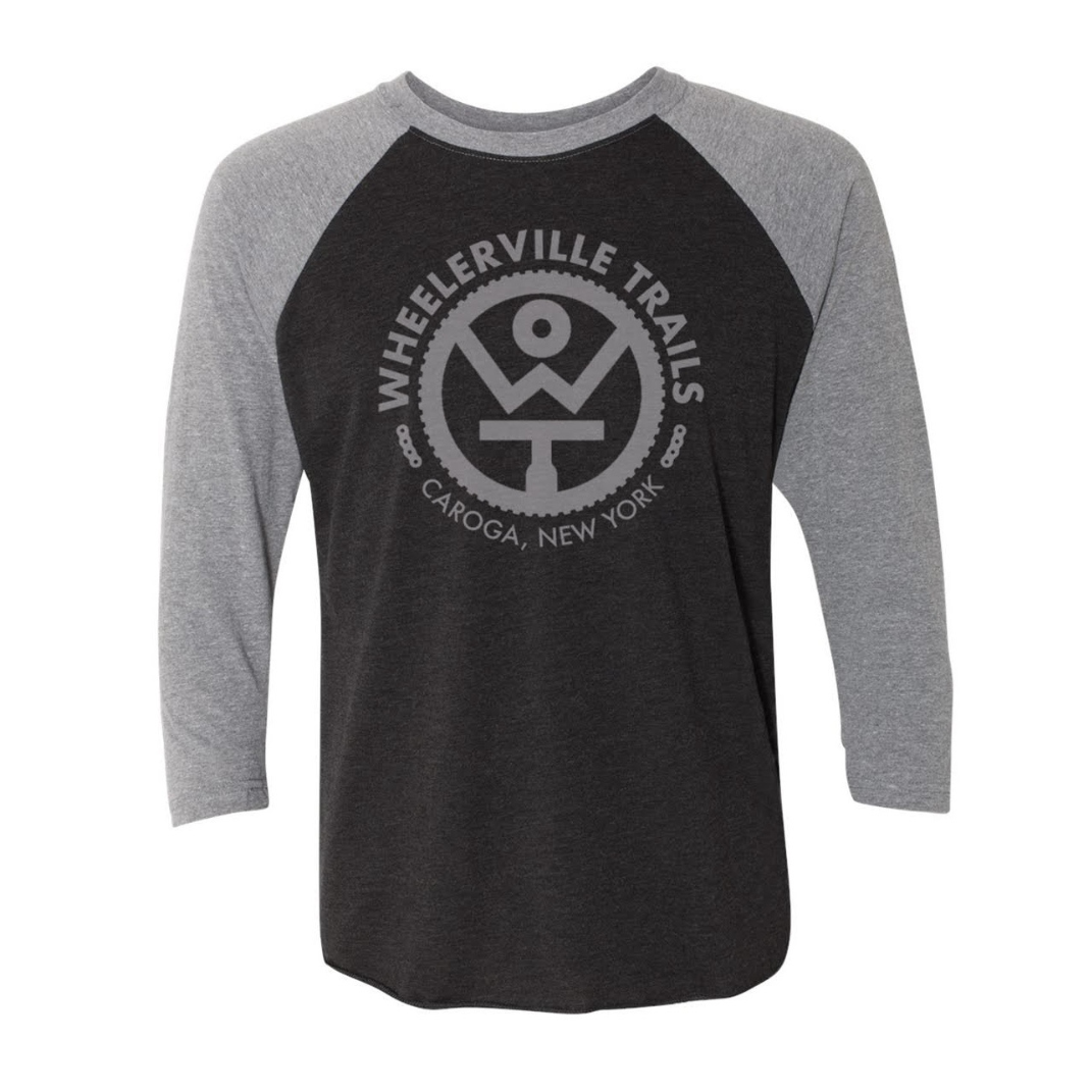 Black and gray baseball shirt with Wheelerville Trails logo on a white background